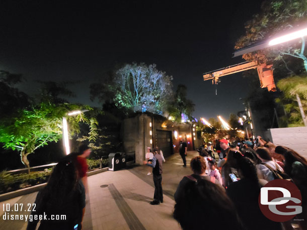 Werewolf by Night appears on the ledge over looking the walkway to Cars Land.  On the right is a mix of guests in line for Dr. Strange plus those trying to photograph the Werewolf.  Cast Members tried to keep a walkway open on the left.