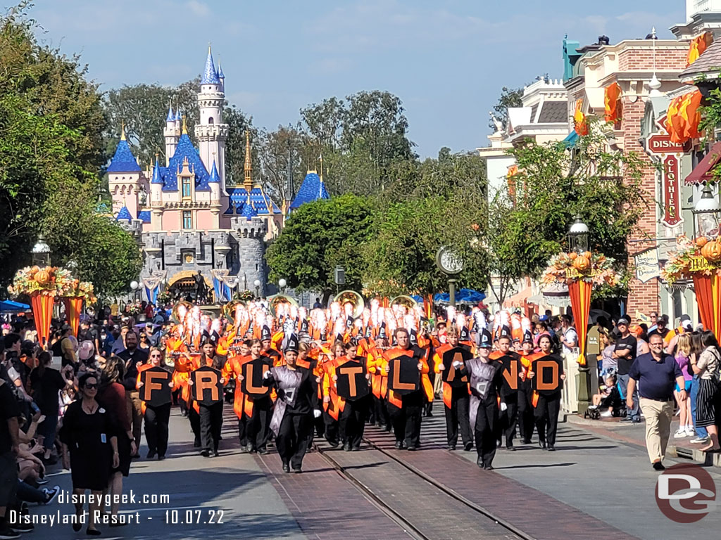 A Band from Idaho marching through the park.