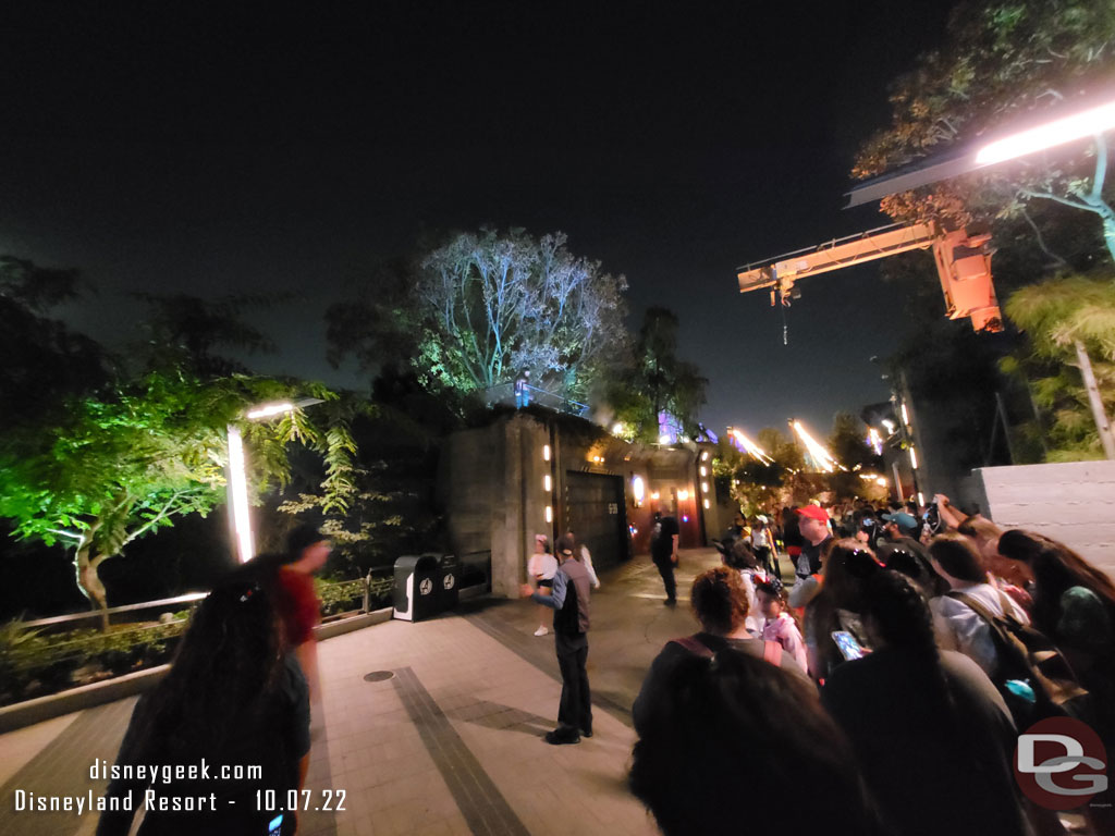 Werewolf by Night appears on the ledge over looking the walkway to Cars Land.  On the right is a mix of guests in line for Dr. Strange plus those trying to photograph the Werewolf.  Cast Members tried to keep a walkway open on the left.