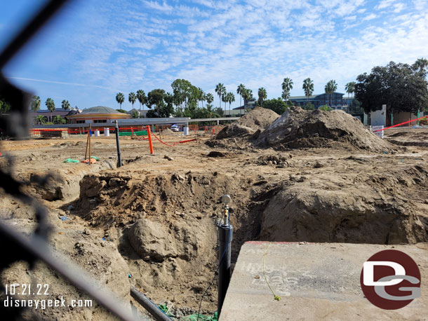 A hole in the fence allows a ground level view of the Downtown Disney project.