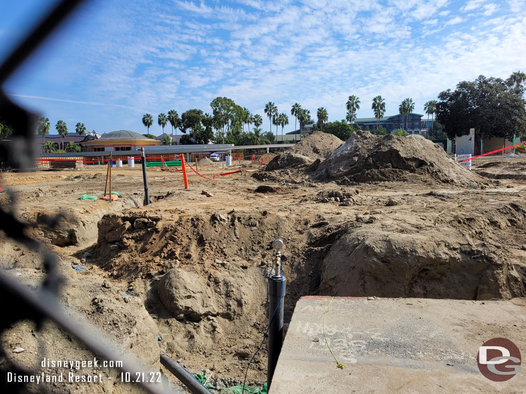 A hole in the fence allows a ground level view of the Downtown Disney project.