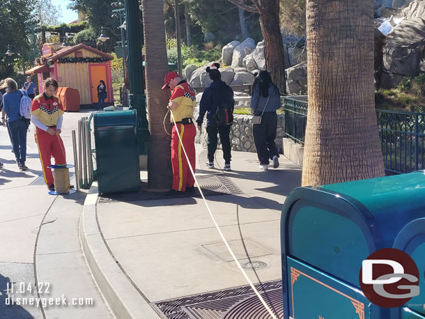 Cast Members were preparing ropes for future queue and crowd flow needs. They were cutting and labeling them.