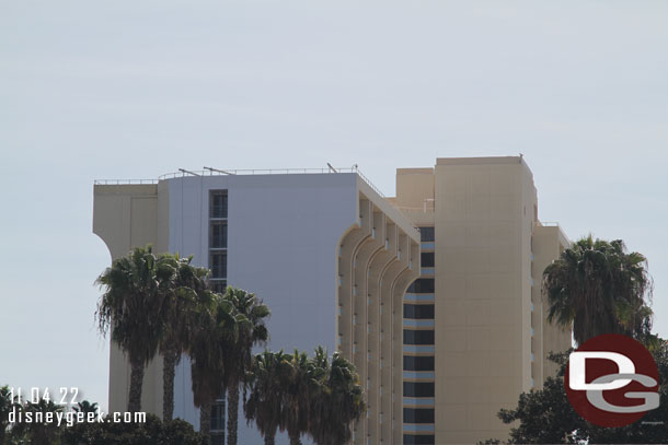 Repainting of the Paradise Pier Hotel is underway as it is being transformed into the Pixar Place Hotel.