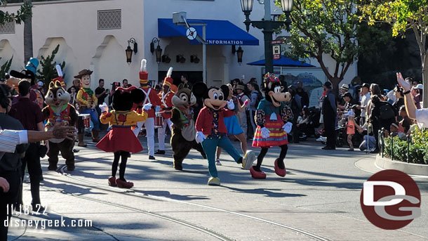 Mickey and Minnie leading Mickey's Happy Holidays through Carthay Circle.