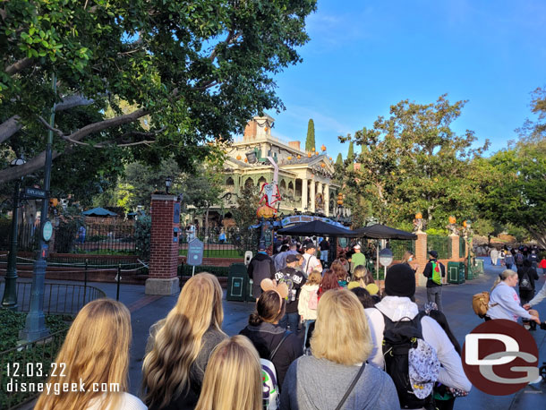 8:06am - In line for Haunted Mansion Holiday, a slight delay entering the grounds.