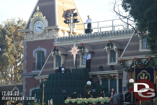 Cast Members preparing for the evening, uncovering lights and doing other checks/adjustments