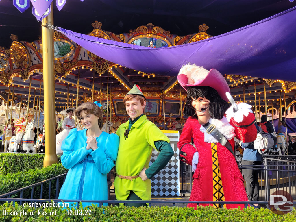 Wendy, Peter Pan and Captain Hook were out visiting guests near the Carousel. 