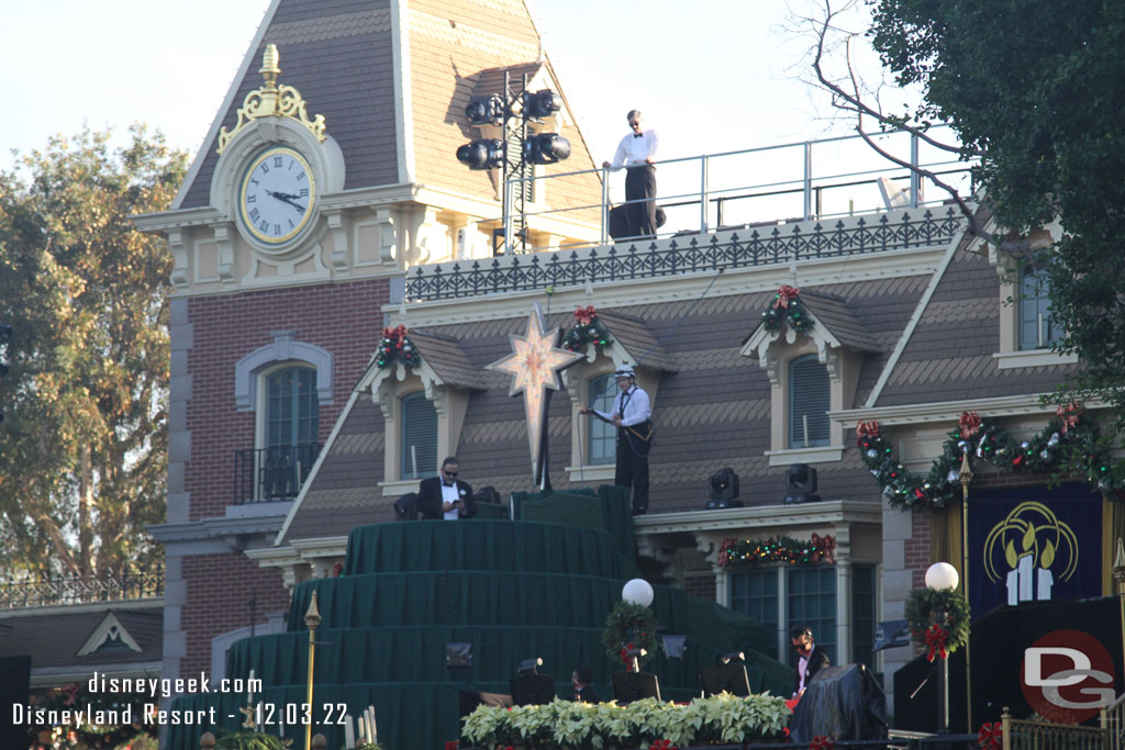 Cast Members preparing for the evening, uncovering lights and doing other checks/adjustments