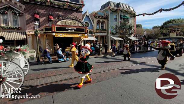 Daisy Duck, Pluto, Chip and Dale walking behind