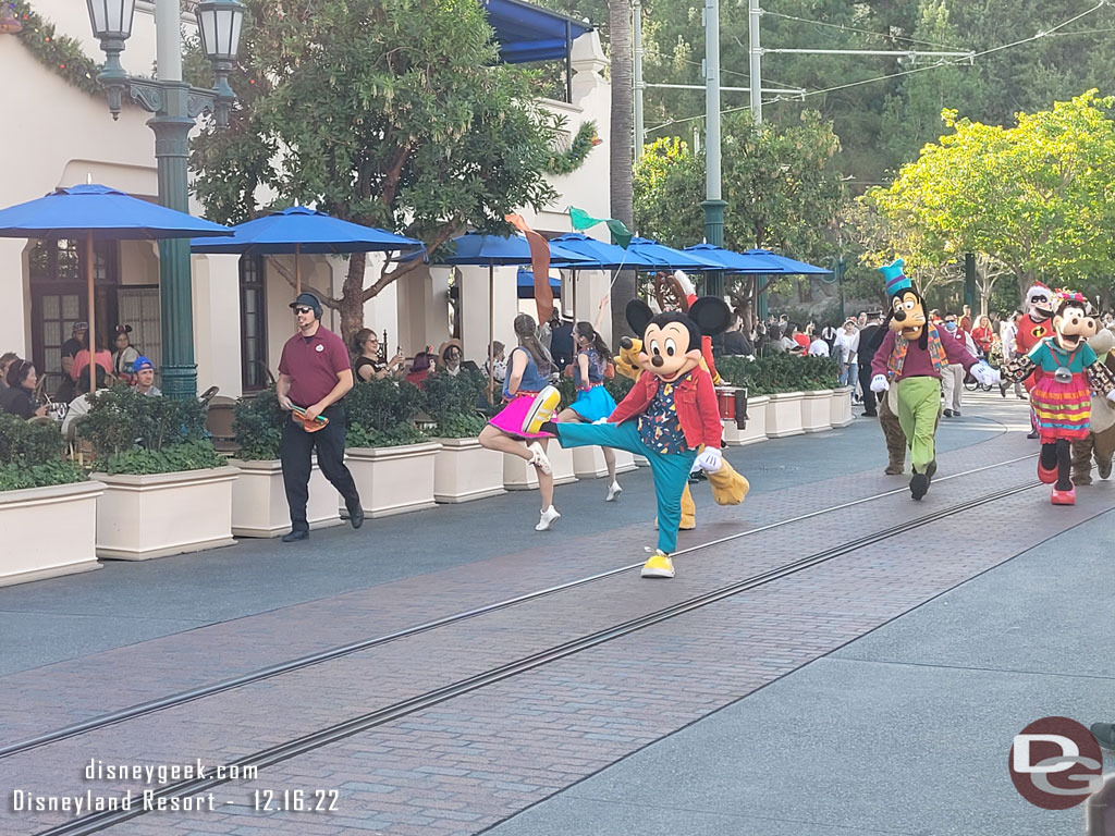 Mickey Mouse leading the way, Minnie was led backstage.