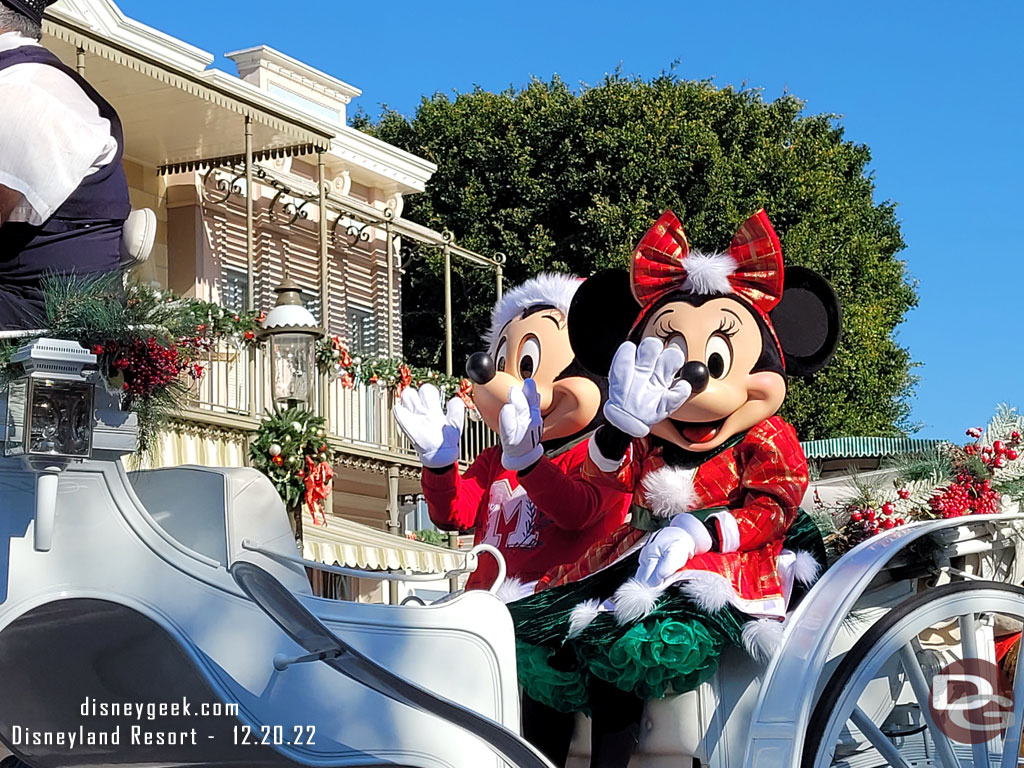 Mickey and Minnie Mouse in the lead carriage.  