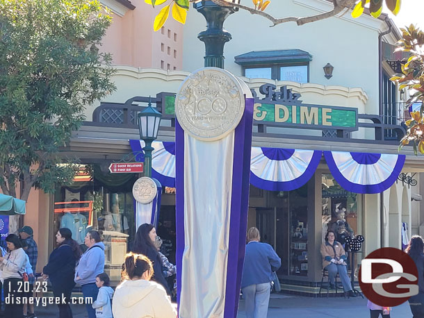 Buena Vista Street has Disney 100 banners and decorations.