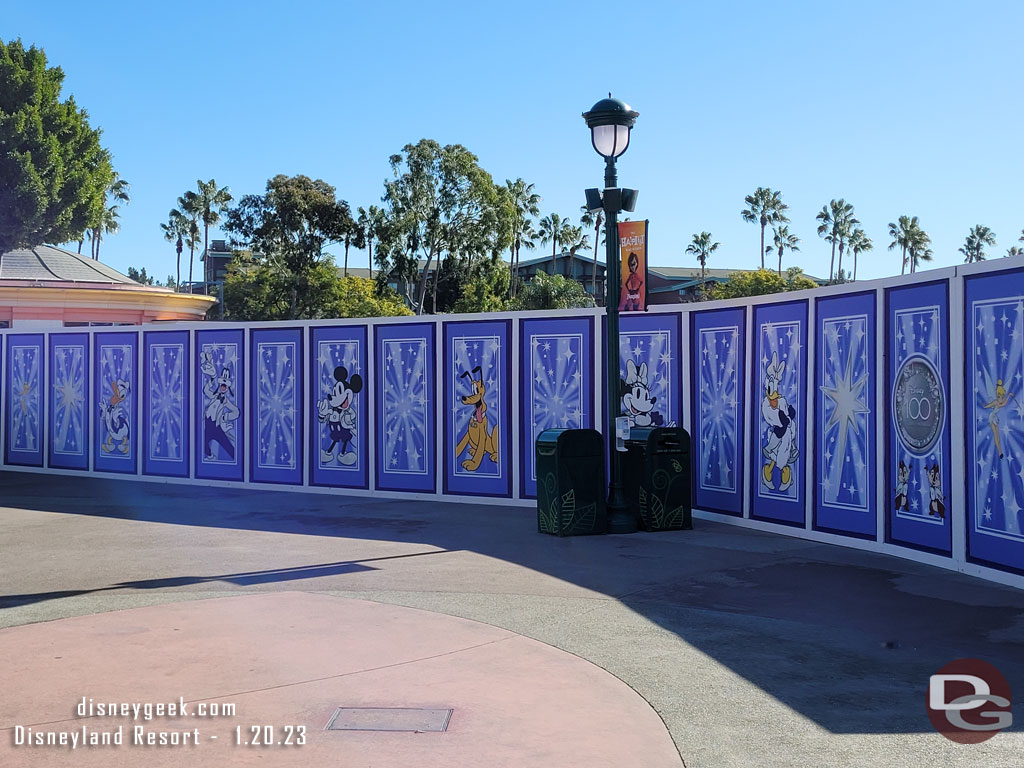 The construction walls in Downtown Disney feature Disney100 graphics