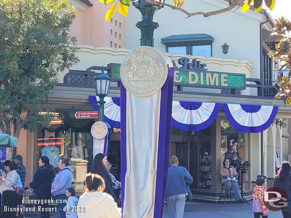 Buena Vista Street has Disney 100 banners and decorations.