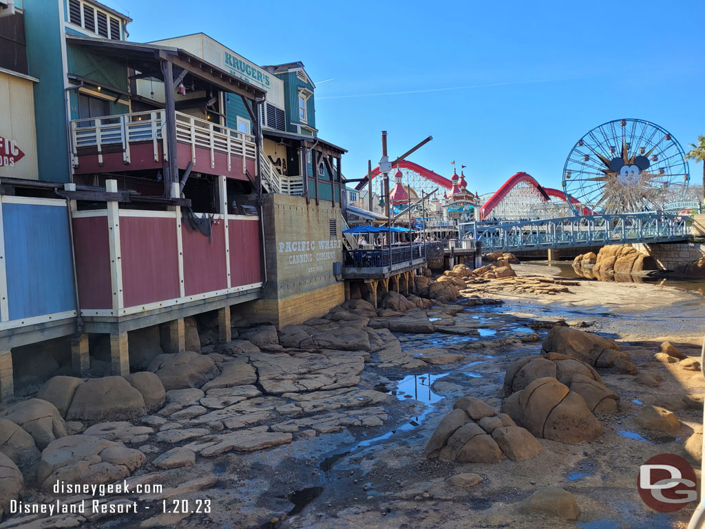 The water has been drained from the tidal basin in the Pacific Wharf for regular renovation and the Big Hero 6 conversion to get underway.