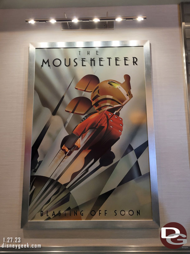 Film posters are throughout the queue.