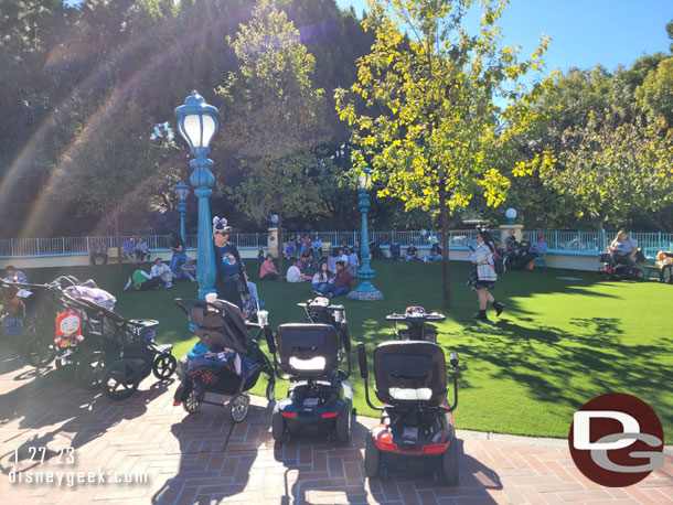 The fountain and pavement in front of Car Toon Spin has been replaced with a park.