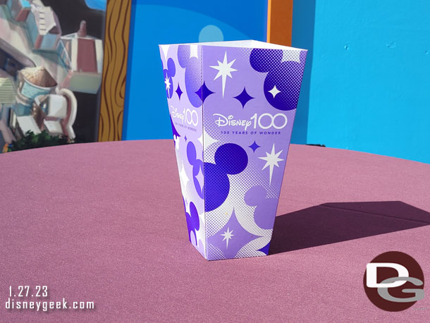 Random Disney100 popcorn container on a table..