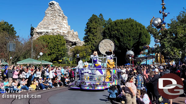 Mickey and the gang ride a float for the finale in their Disney100 outfits.