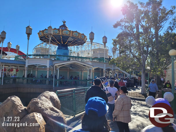 2:13pm - In line for the Magic Key Lunar New Year button (distribution is from 1-5 daily under the swings until they run out)