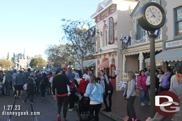 Cast members out greeting guests.