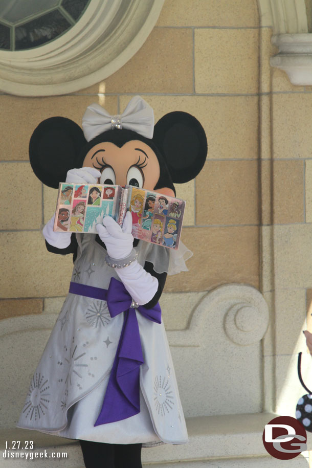 Minnie Mouse signing an autograph