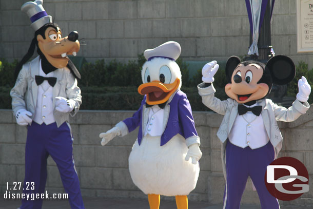 Mickey and the gang have their Disney100 Platinum outfits on.