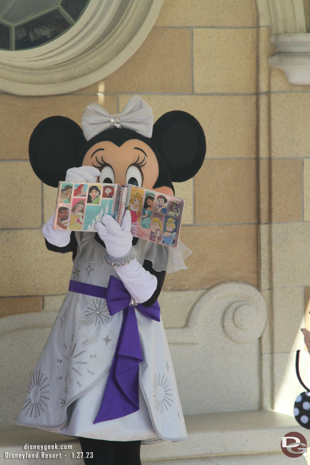 Minnie Mouse signing an autograph