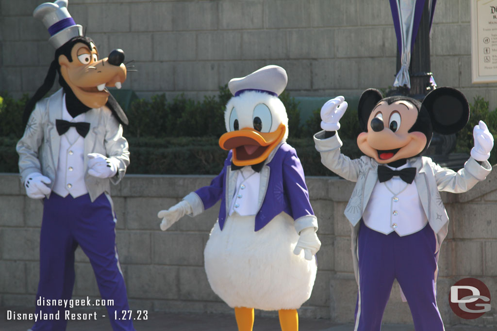 Mickey and the gang have their Disney100 Platinum outfits on.