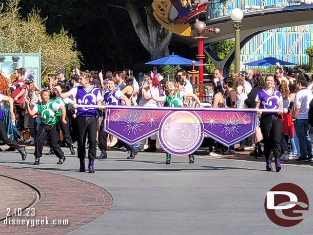 The Disney100 Mickey and Friends Cavalcade arriving in the hub.