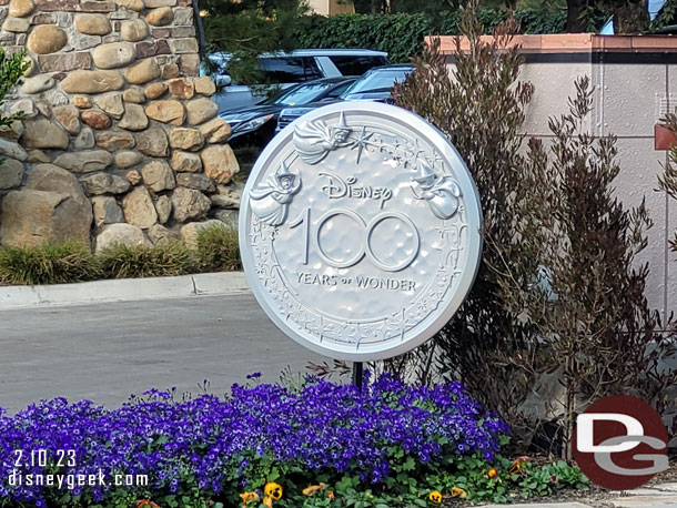 A Disney100 medallion at the hotel entrance