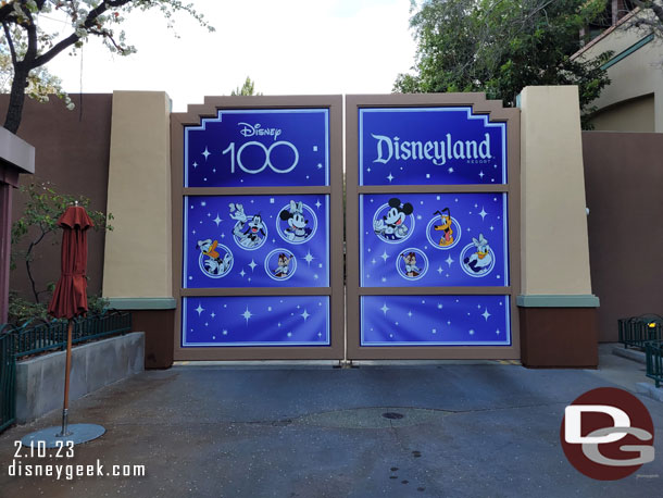 The large gate to Disney California Adventure near the World of Disney entrance features a Disney100 photo opportunity.  