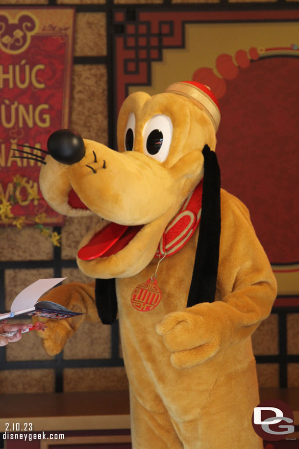 Pluto was out greeting guests for Lunar New Year