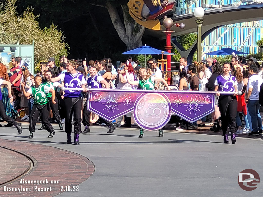 The Disney100 Mickey and Friends Cavalcade arriving in the hub.