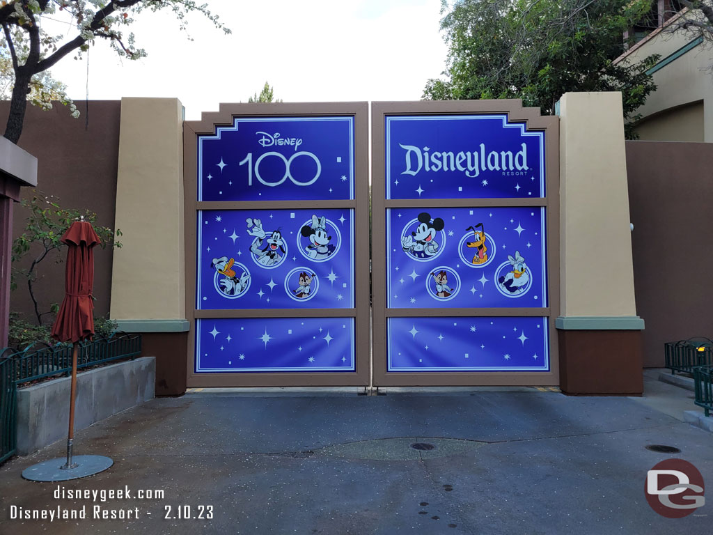 The large gate to Disney California Adventure near the World of Disney entrance features a Disney100 photo opportunity.  