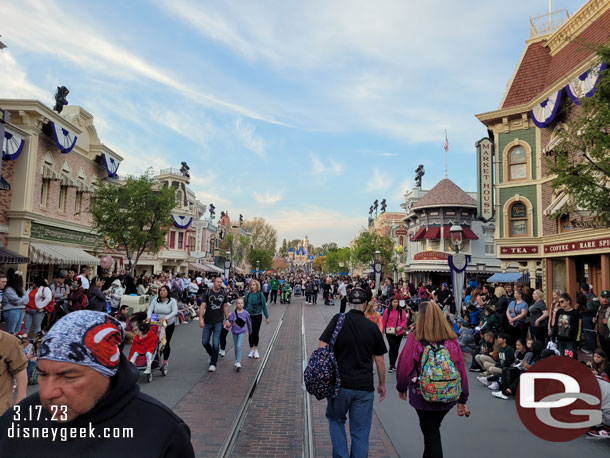 Main Street USA at 6:29pm, guests waiting for the 6:30 Magic Happens Parade