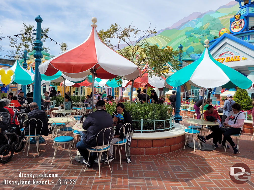 The tables and chairs are out in the courtyard.