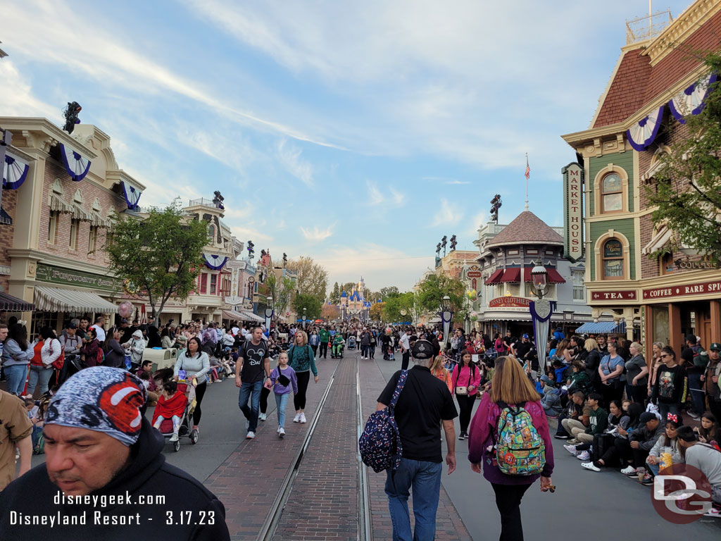 Main Street USA at 6:29pm, guests waiting for the 6:30 Magic Happens Parade