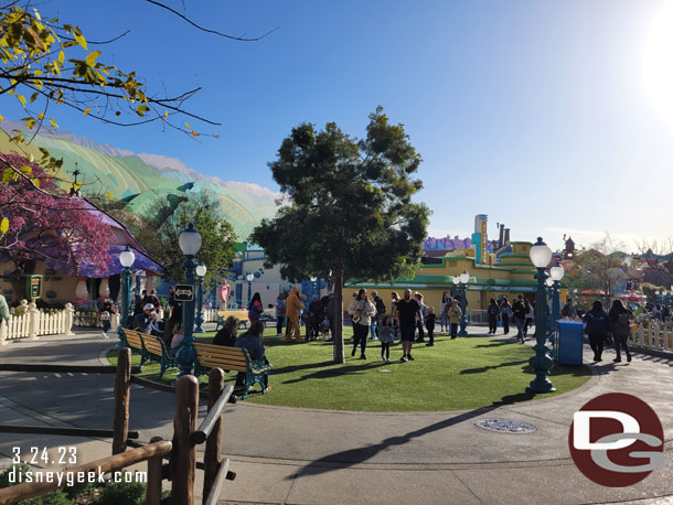 The area in front of the houses is more grass and a tree.  