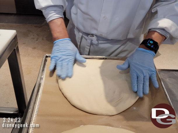 In the Pacific Wharf Bakery they were making Mickey Bread this afternoon.  Here the cast member is flattening the dough