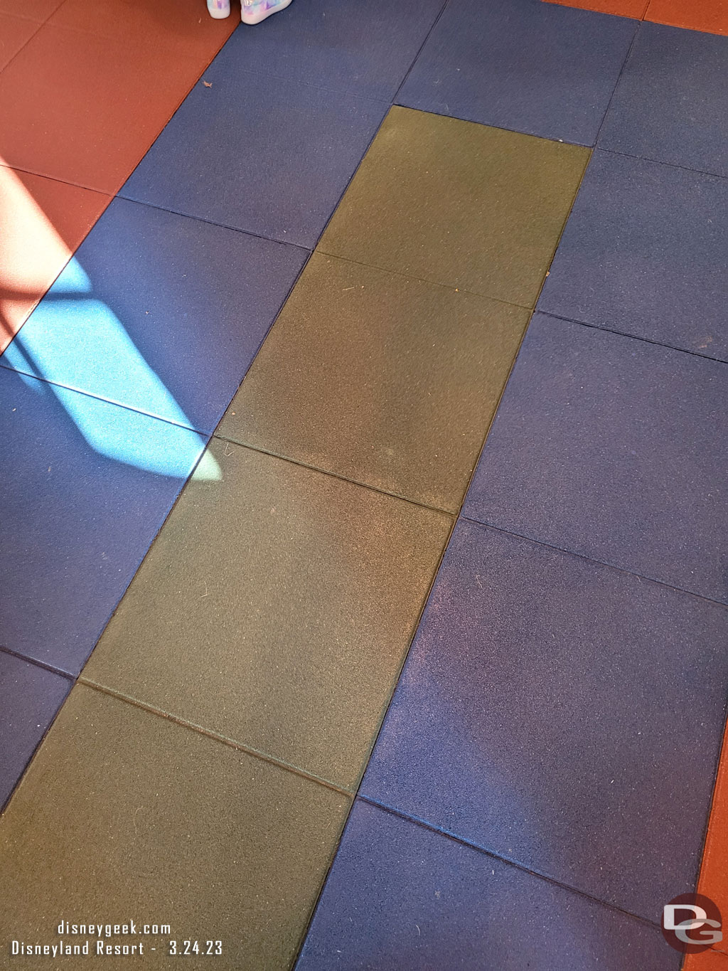 The floor has some give to it as you walk around. It is not hard/concrete.