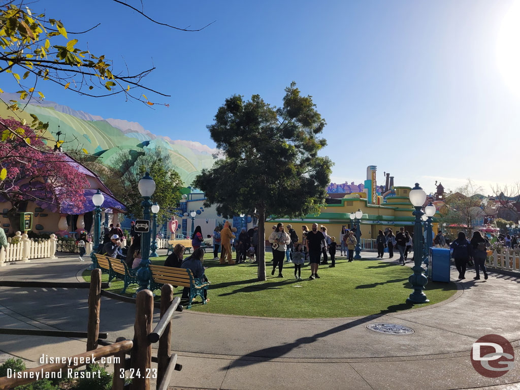 The area in front of the houses is more grass and a tree.  