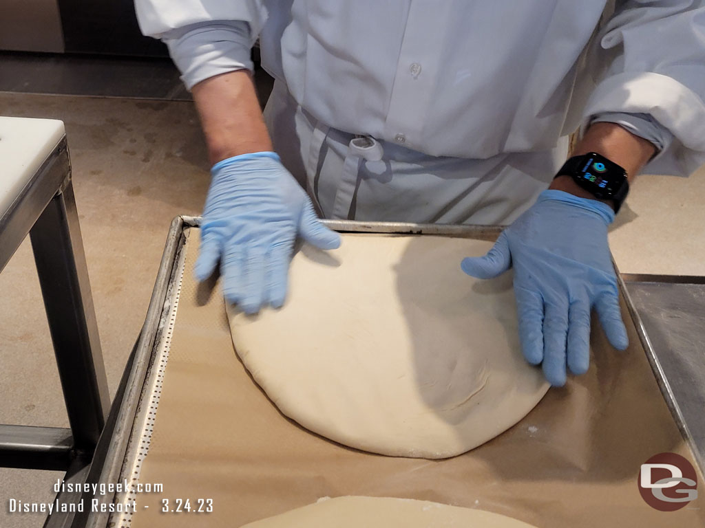 In the Pacific Wharf Bakery they were making Mickey Bread this afternoon.  Here the cast member is flattening the dough