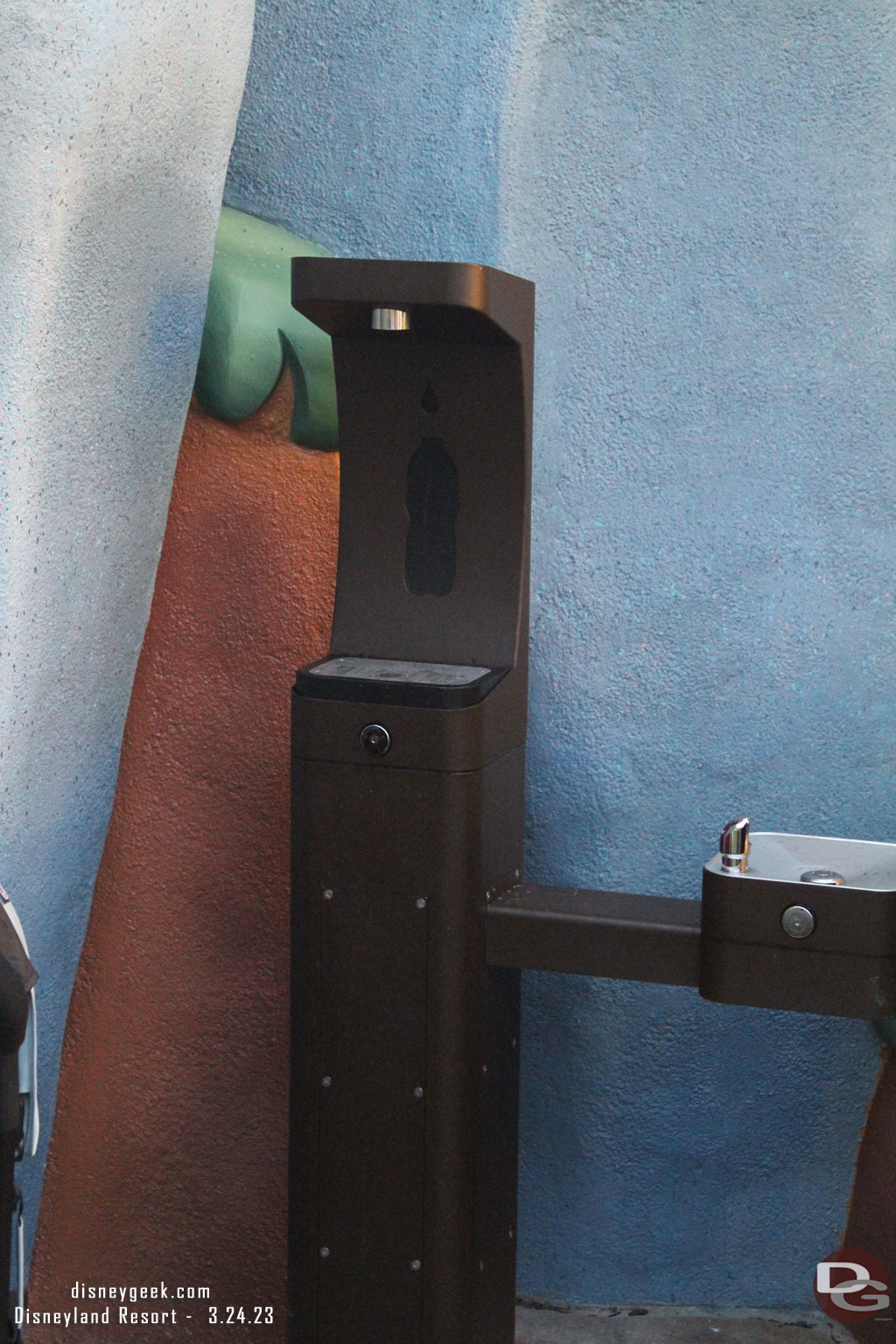 A bottle filling station and drinking fountain past the pop corn stand toward where the tree house used to be.