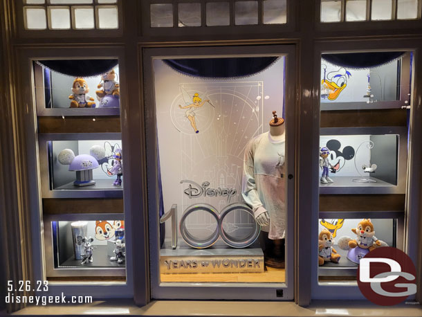 The Disney 100 window at the Disney Showcase on Main Street USA