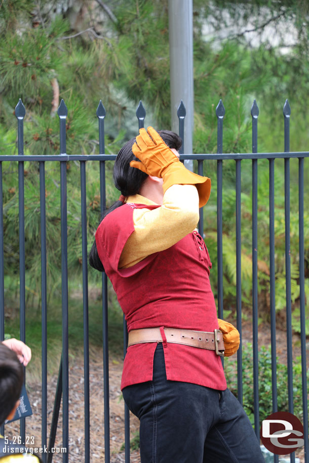 Gaston was posing for pictures across from the Alice in Wonderland attraction.