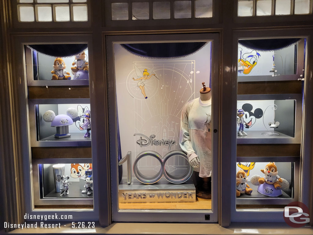 The Disney 100 window at the Disney Showcase on Main Street USA