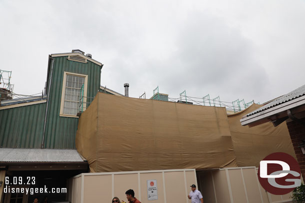 Scaffolding and scrims still obstruct the view of the bakery work.