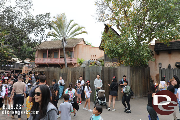 Walls are up around the fountain area in Adventureland.  There was a pipe issue here last weekend.  The restrooms are still accessible as are the walkways but it is narrow and congested.