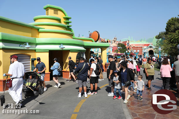 A line of guests for the drinking fountain.. blocking the walkway.